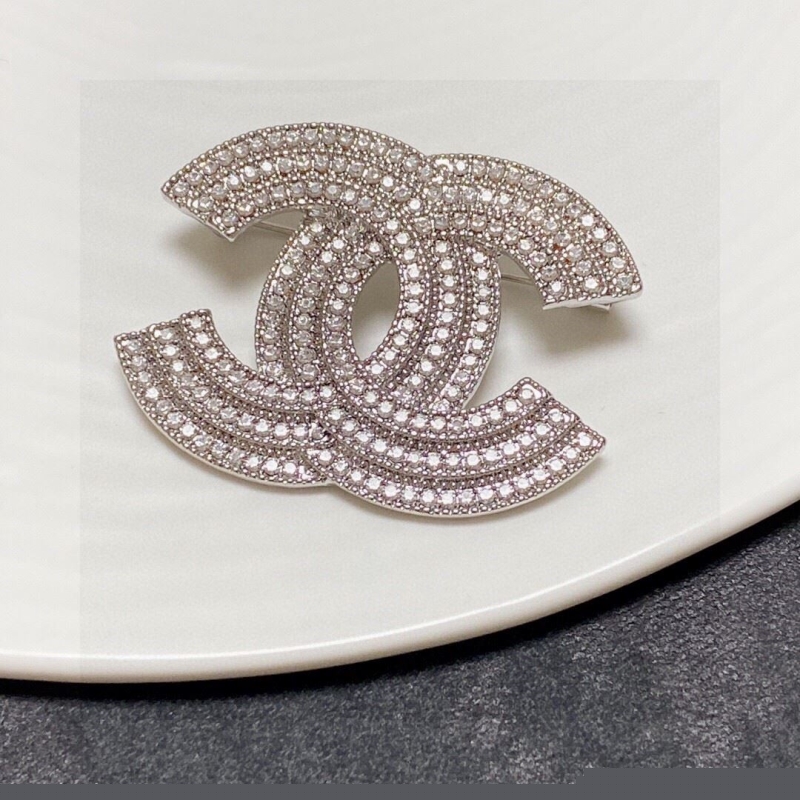 Ch*el brooches